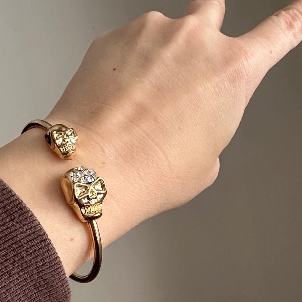 Gold Tone Double Skull Adjustable Bangle Bracelet